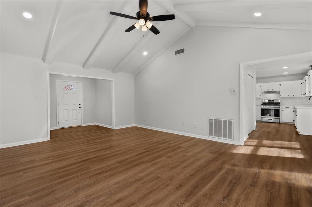 809 Princesa Drive Haughton, LA 71037 - Photo 7 of 17 a view of empty room with wooden floor and ceiling fan