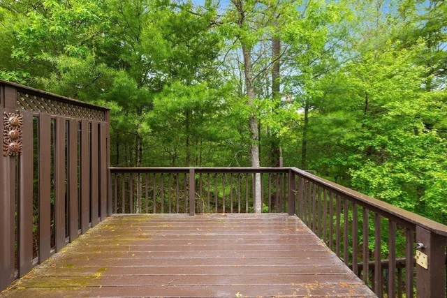 a balcony with trees in front of it