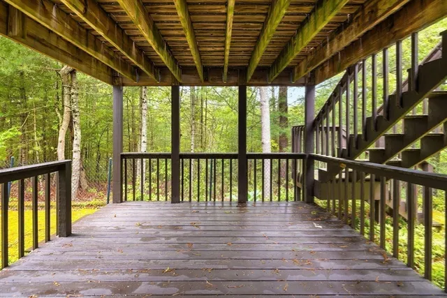 a view of a balcony with wooden floor
