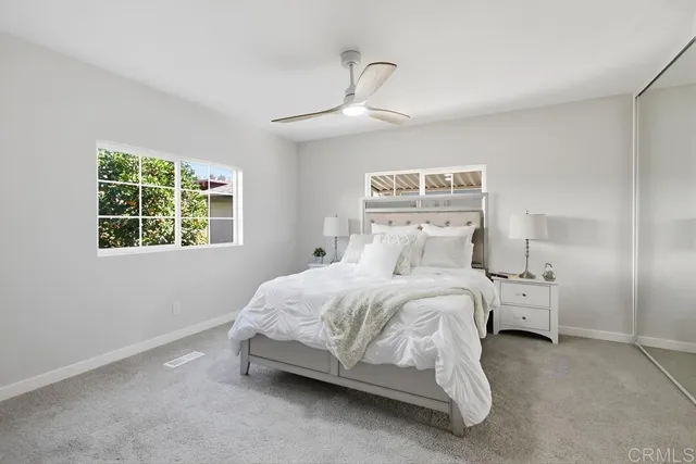 a bedroom with a bed and window
