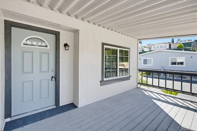 a view of a chair and table in the garden
