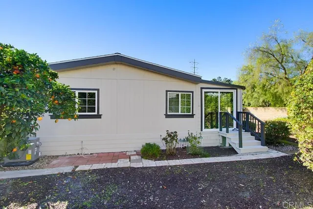 a view of a porch with wooden floor and stairs
