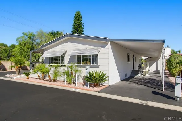 a view of a chairs and table on the balcony