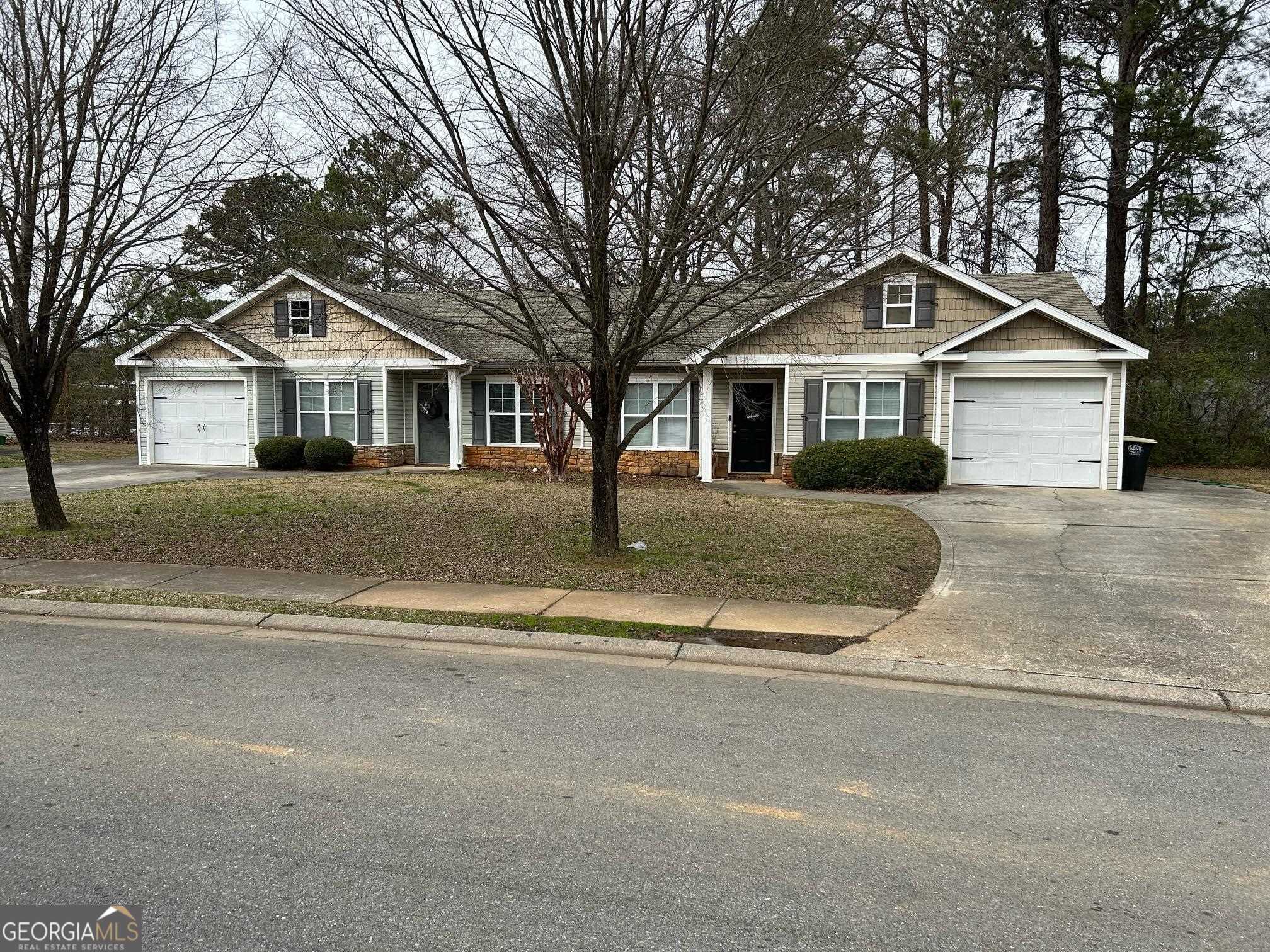front view of a house with a yard