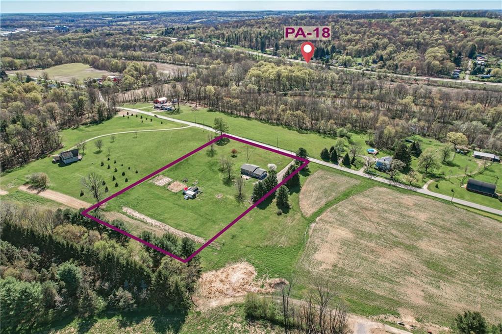 240 Hamburg Road Greenville, PA 16125 - Photo 11 of 46 an aerial view of a tennis ground and a large tree