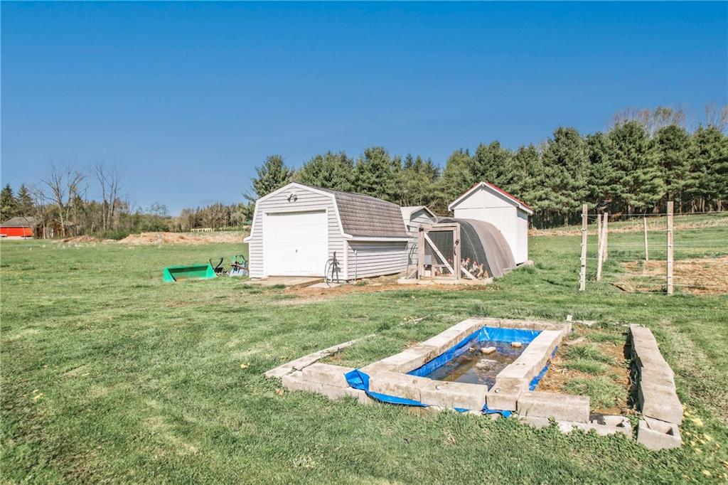240 Hamburg Road Greenville, PA 16125 - Photo 15 of 46 a view of a backyard with a garden and entertaining space