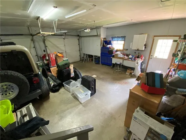 a living room with furniture and a mirror