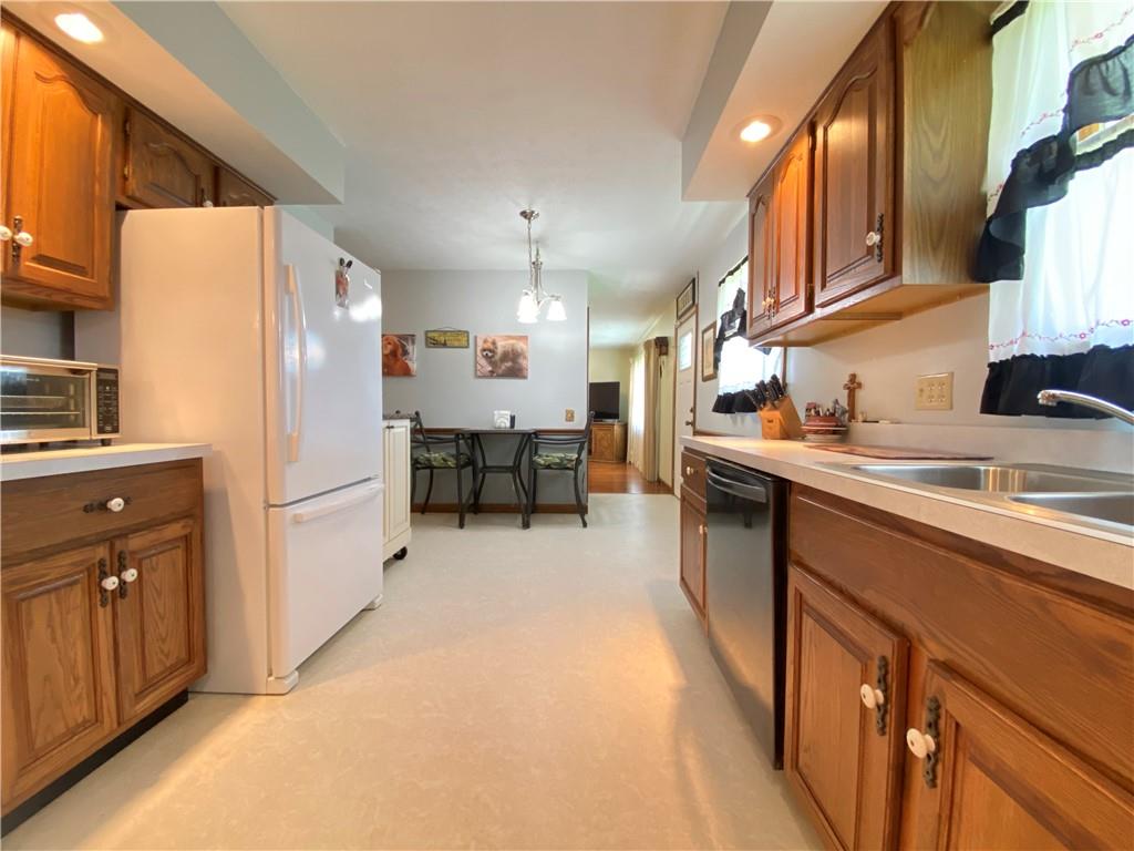 240 Hamburg Road Greenville, PA 16125 - Photo 23 of 46 a kitchen with a sink a refrigerator and cabinets