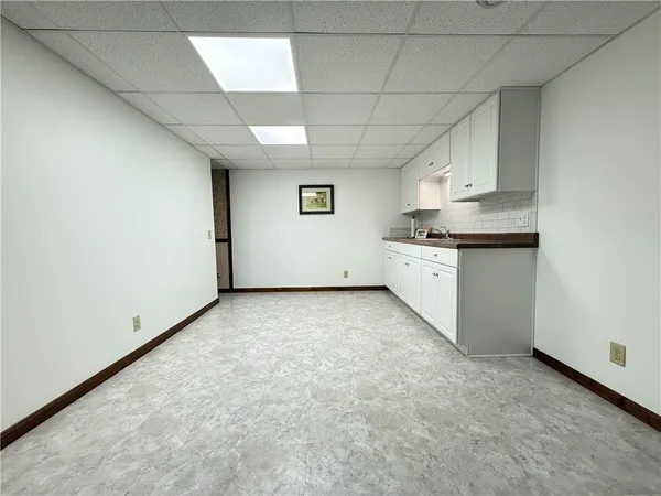 a view of a kitchen with granite countertop cabinets and sink