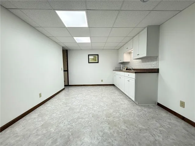 a view of a kitchen with granite countertop cabinets and sink