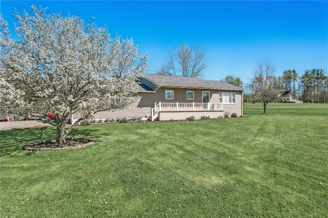 a view of a house with a big yard