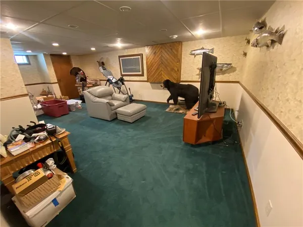 a bed room with furniture and a flat screen tv