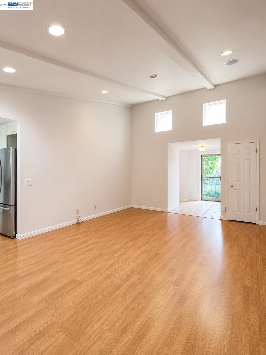 2516 Dos Rios Drive San Ramon, CA 94583 - Photo 4 of 14 a view of an empty room with wooden floor and a window