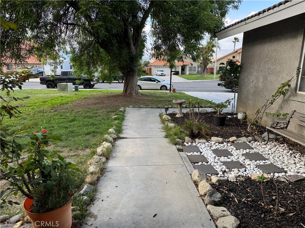 44063 Lately Circle Hemet, CA 92544 - Photo 12 of 75 a pathway of a house with a yard