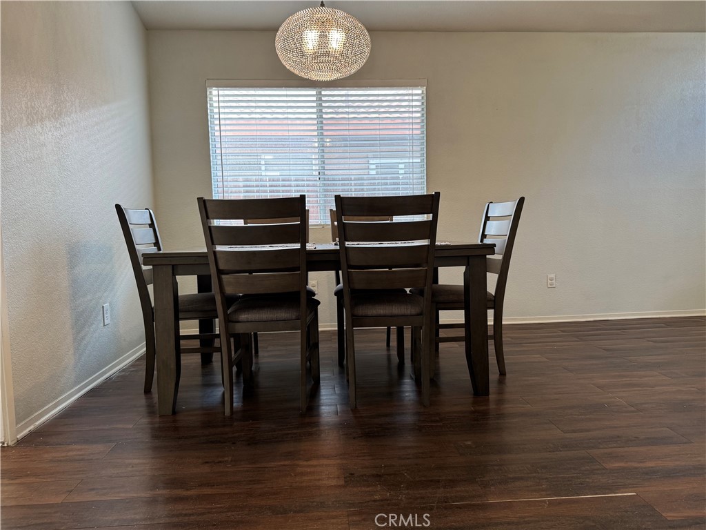 44063 Lately Circle Hemet, CA 92544 - Photo 18 of 75 a view of a dining room with furniture and wooden floor