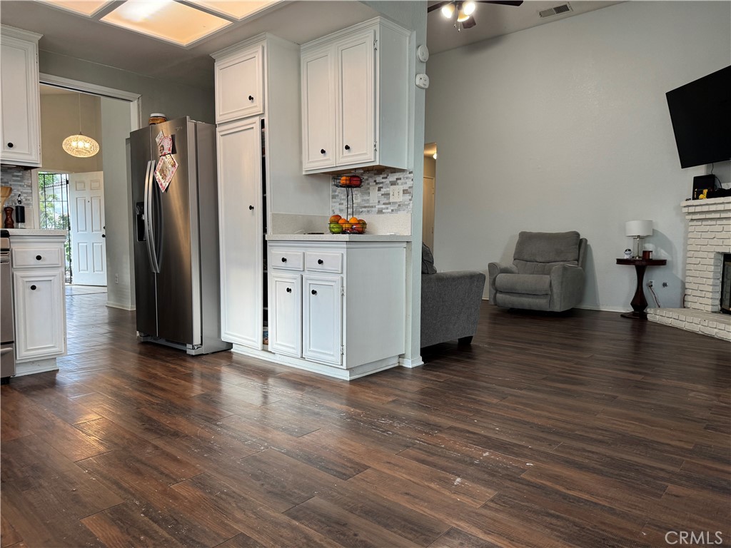 44063 Lately Circle Hemet, CA 92544 - Photo 29 of 75 a kitchen with stainless steel appliances granite countertop a refrigerator and a stove top oven