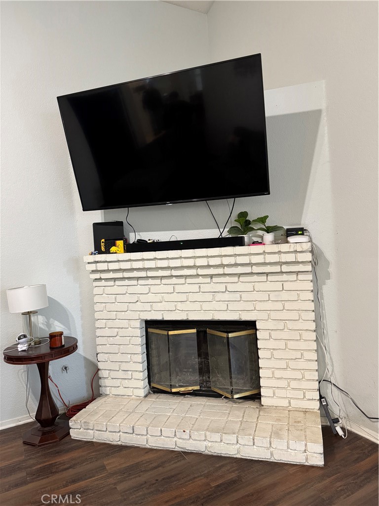 44063 Lately Circle Hemet, CA 92544 - Photo 43 of 75 a living room with a fireplace and a flat screen tv