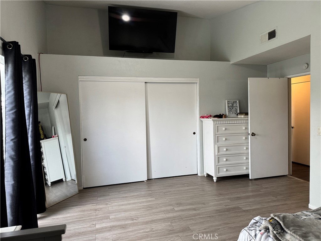 44063 Lately Circle Hemet, CA 92544 - Photo 48 of 75 a view of walk in closet with clothes and shoes