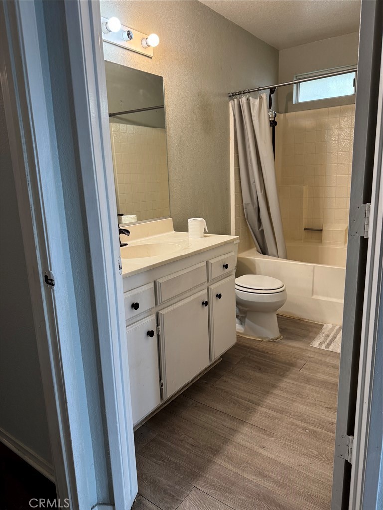 44063 Lately Circle Hemet, CA 92544 - Photo 50 of 75 a bathroom with a sink a toilet a mirror and vanity