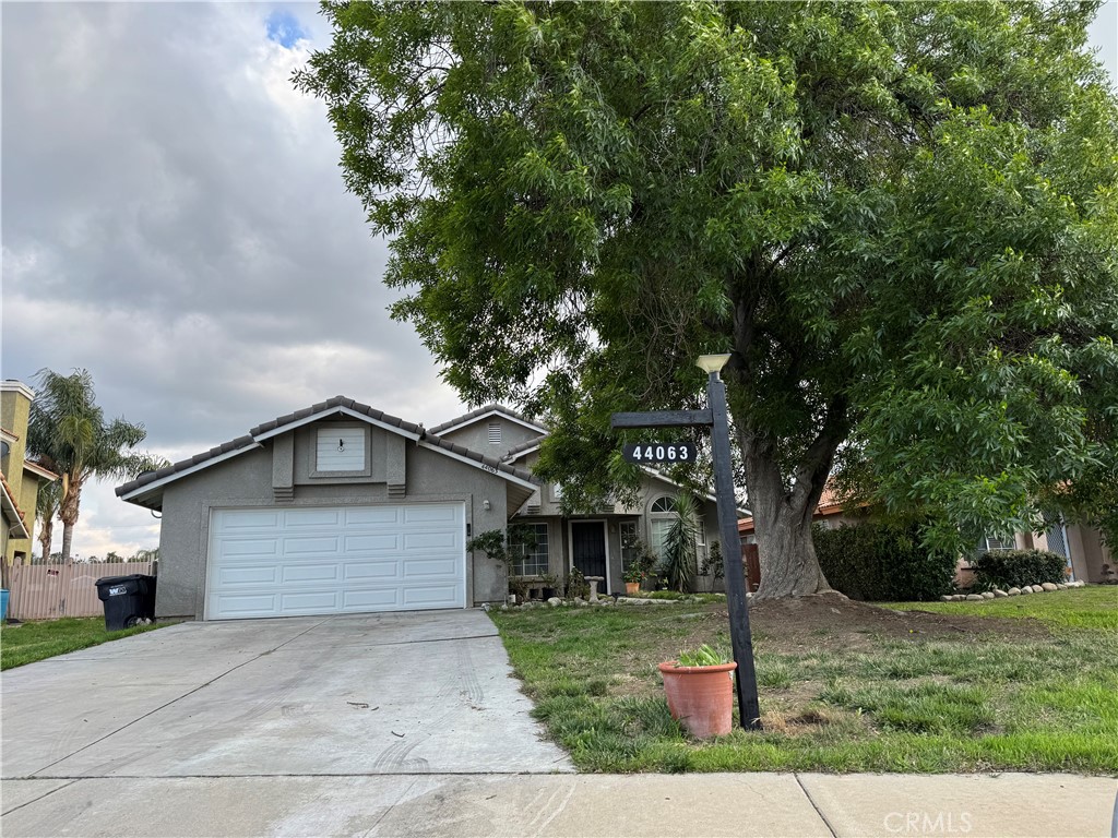 44063 Lately Circle Hemet, CA 92544 - Photo 70 of 75 a front view of a house with a garden