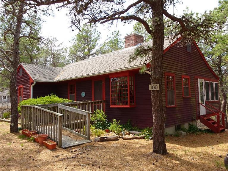100 Cranberry Hollow Road Wellfleet, MA 02667 - Photo 1 of 1 a front view of a house with garden
