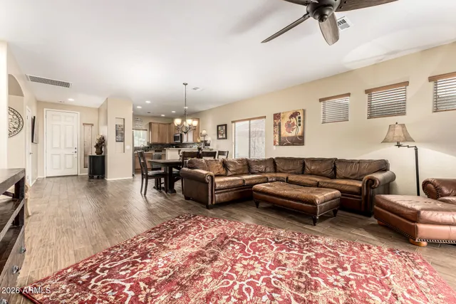 a living room with furniture and a rug