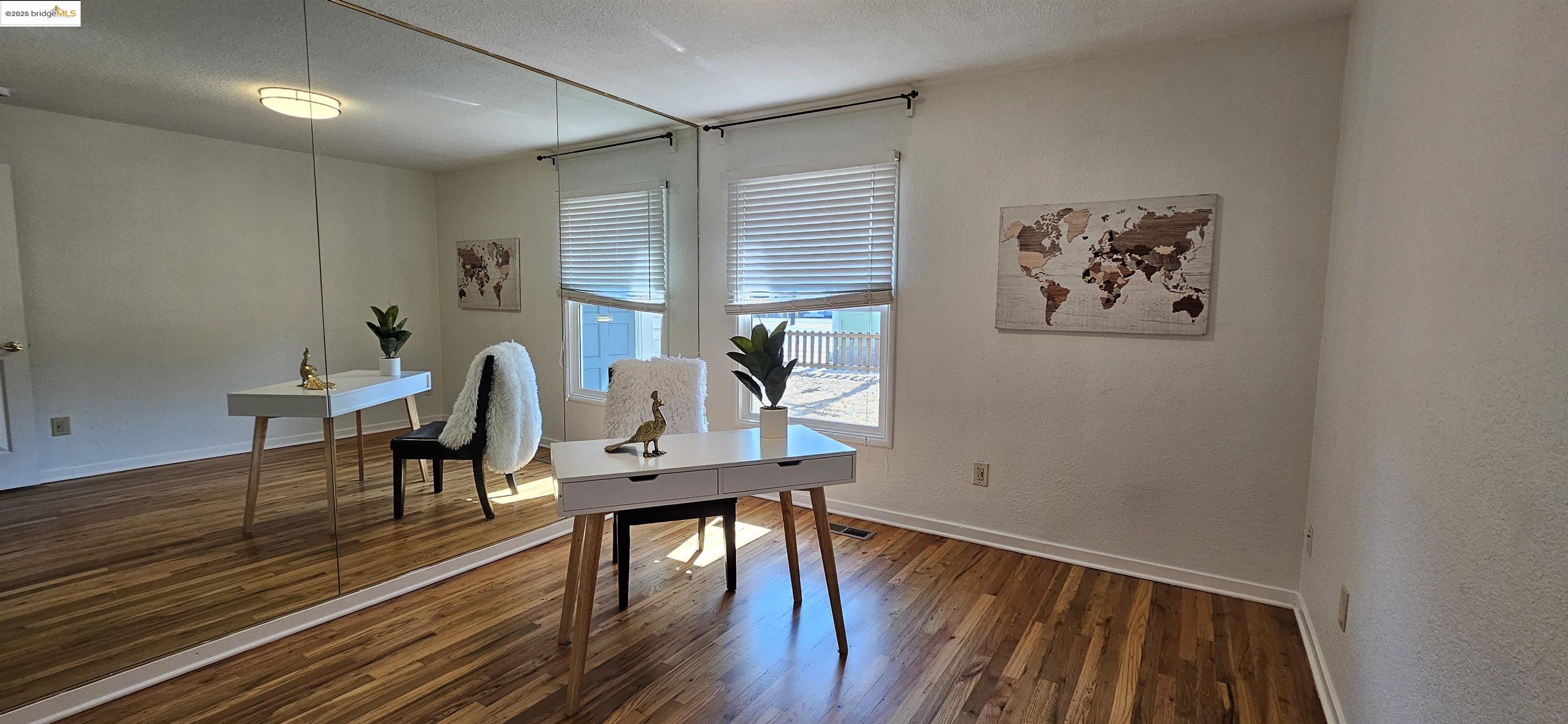 3195 Willow Pass Road Concord, CA 94519 - Photo 14 of 30 a view of a dining room with furniture window and wooden floor