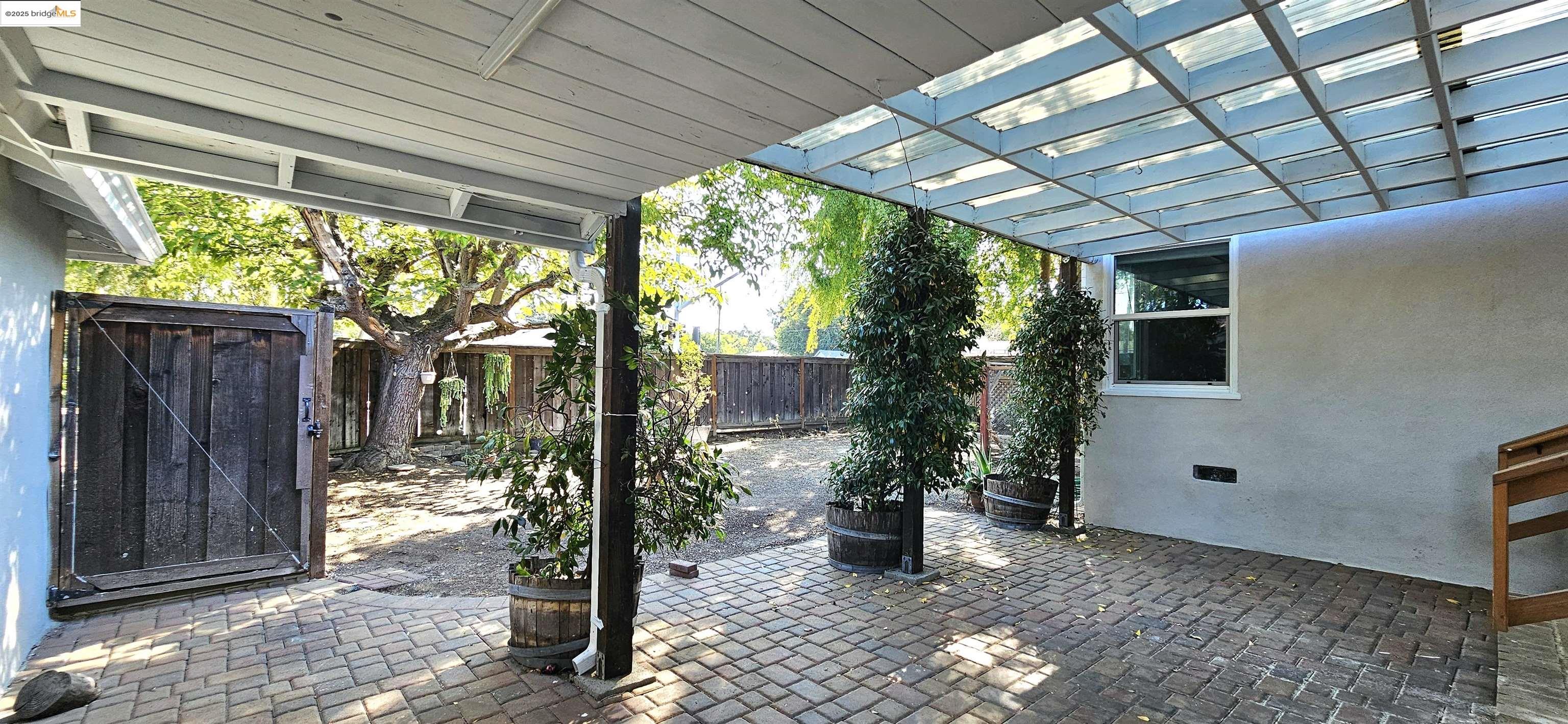 3195 Willow Pass Road Concord, CA 94519 - Photo 24 of 30 a view of a porch with wooden floor and outdoor space