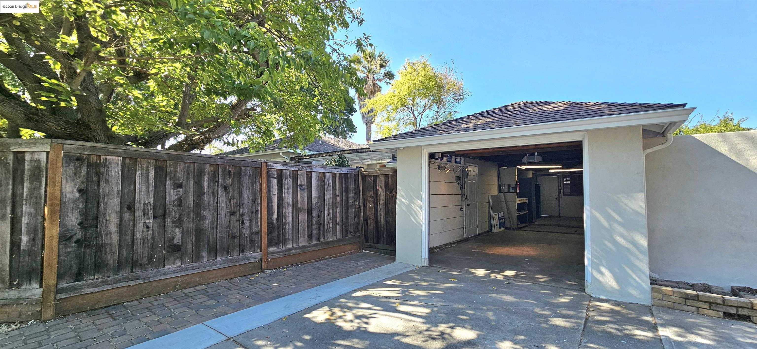 3195 Willow Pass Road Concord, CA 94519 - Photo 27 of 30 a view of a wooden door and a floor to ceiling window