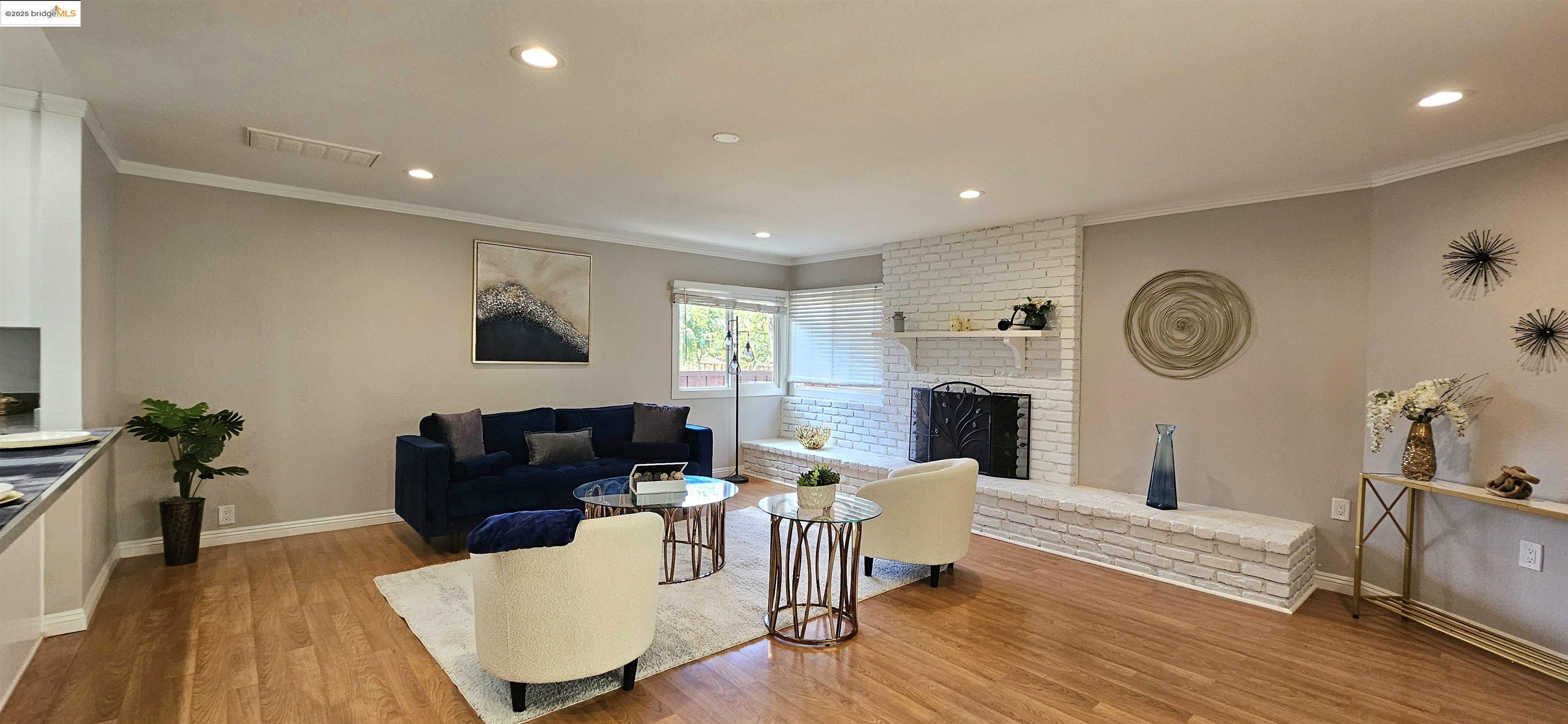 3195 Willow Pass Road Concord, CA 94519 - Photo 10 of 30 a living room with fireplace furniture and a wooden floor