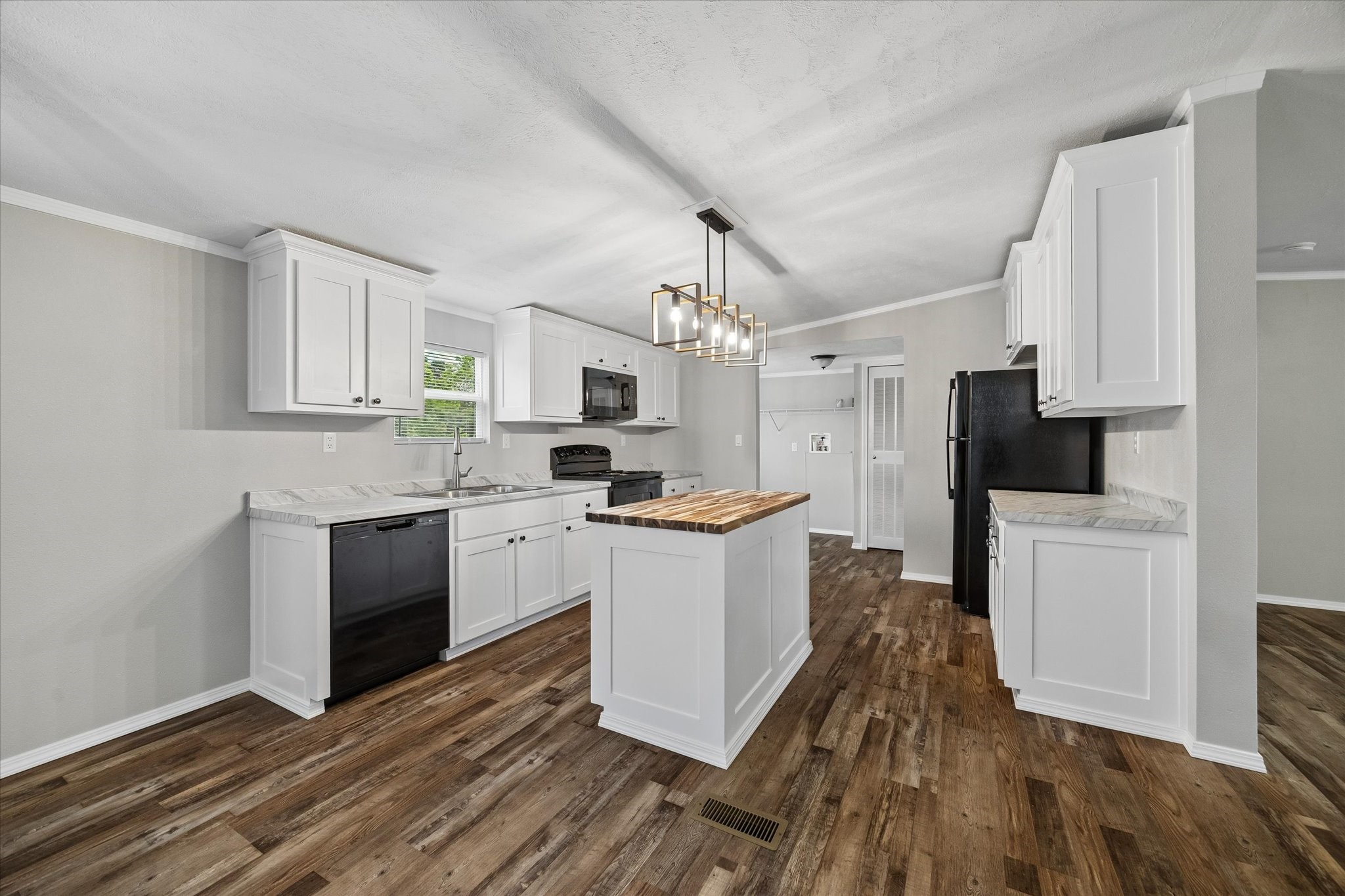 30 Timm Cleveland, TX 77327 - Photo 3 of 10 a kitchen with granite countertop a refrigerator stove top oven and sink