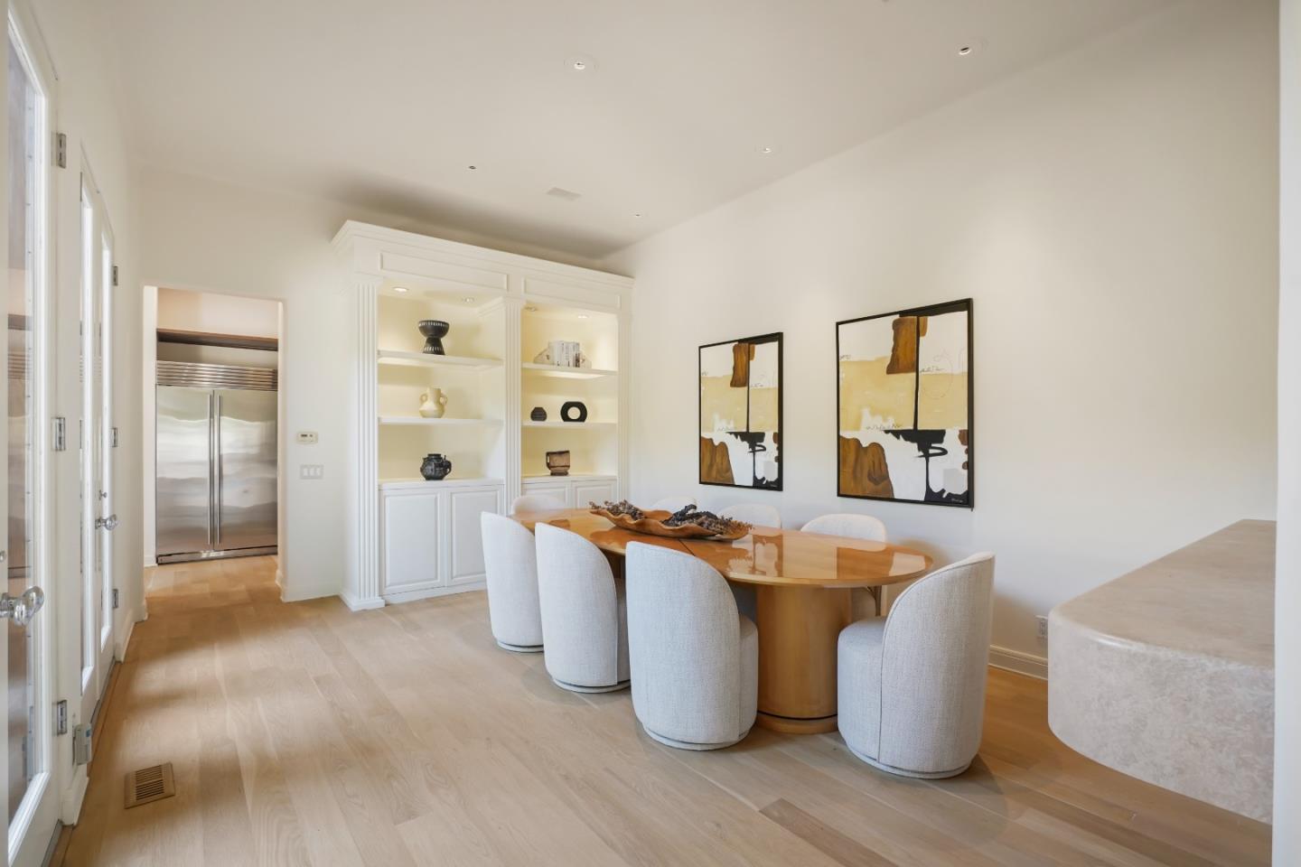 23349 Malibu Colony Road Malibu, CA 90265 - Photo 13 of 43 a living room with stainless steel appliances kitchen island granite countertop a table and chairs