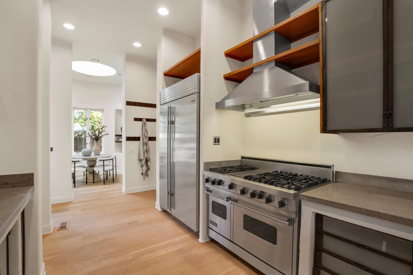 23349 Malibu Colony Road Malibu, CA 90265 - Photo 16 of 43 a kitchen with stainless steel appliances a stove and a refrigerator
