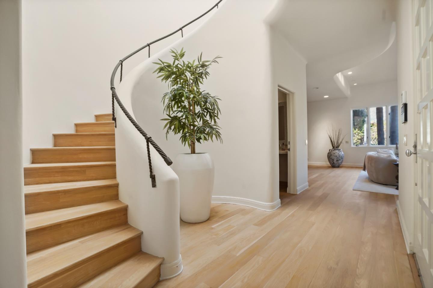 23349 Malibu Colony Road Malibu, CA 90265 - Photo 21 of 43 a view of entryway and hall with wooden floor