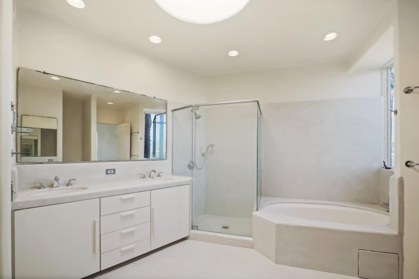 23349 Malibu Colony Road Malibu, CA 90265 - Photo 26 of 43 a spacious bathroom with a double vanity sink toilet mirror and bathtub