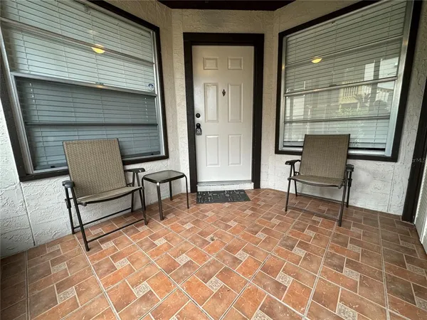 a view of a two chairs in the balcony