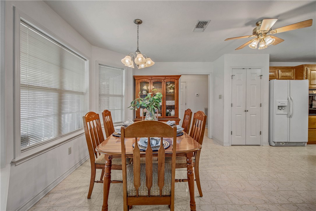 1110 County Road 439 Dime Box, TX 77853 - Photo 17 of 50 a view of a dining room with furniture window and outside view