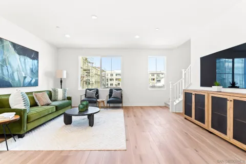 a living room with furniture and windows