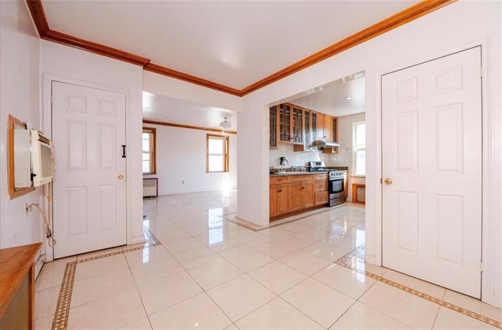 1722 Ave V Brooklyn, NY 11229 - Photo 11 of 28 a view of a kitchen with a sink and a refrigerator