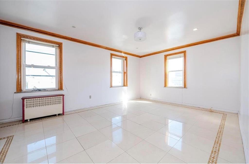 1722 Ave V Brooklyn, NY 11229 - Photo 13 of 28 a view of an empty room with a window