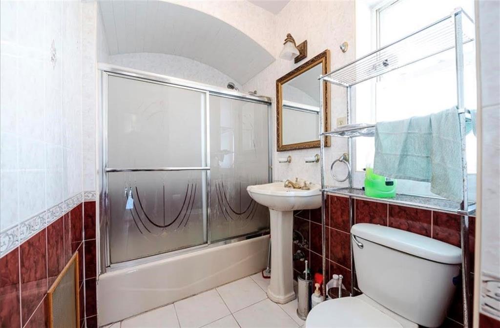 1722 Ave V Brooklyn, NY 11229 - Photo 17 of 28 a bathroom with a sink a toilet and shower