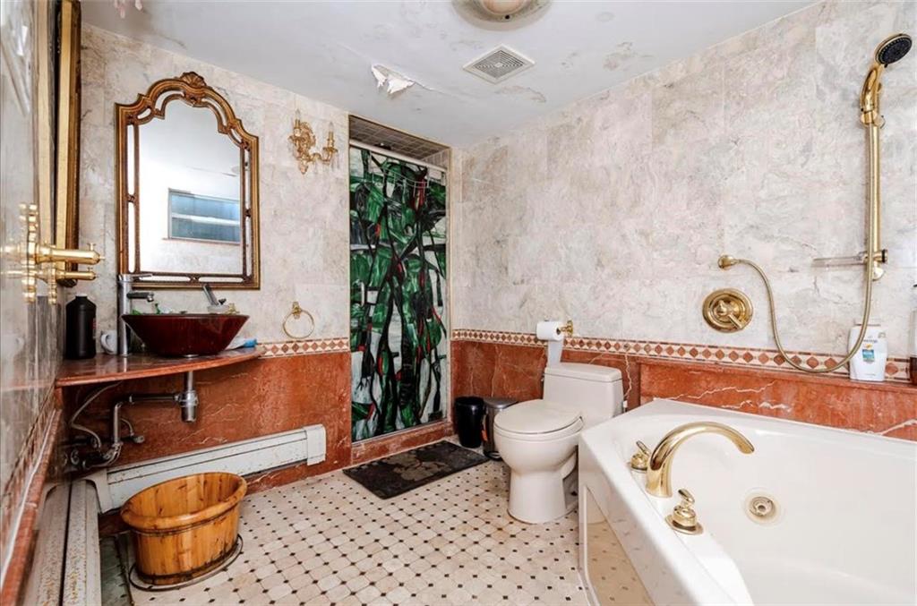 1722 Ave V Brooklyn, NY 11229 - Photo 21 of 28 a bathroom with a sink mirror vanity and toilet