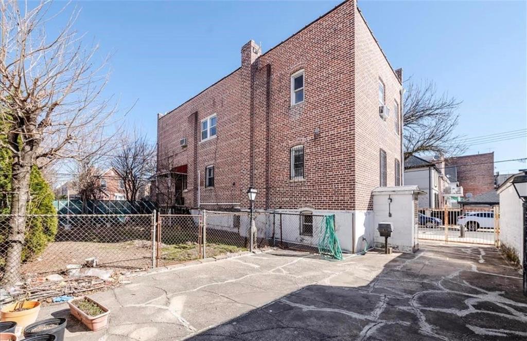 1722 Ave V Brooklyn, NY 11229 - Photo 25 of 28 a backyard of a building with large trees