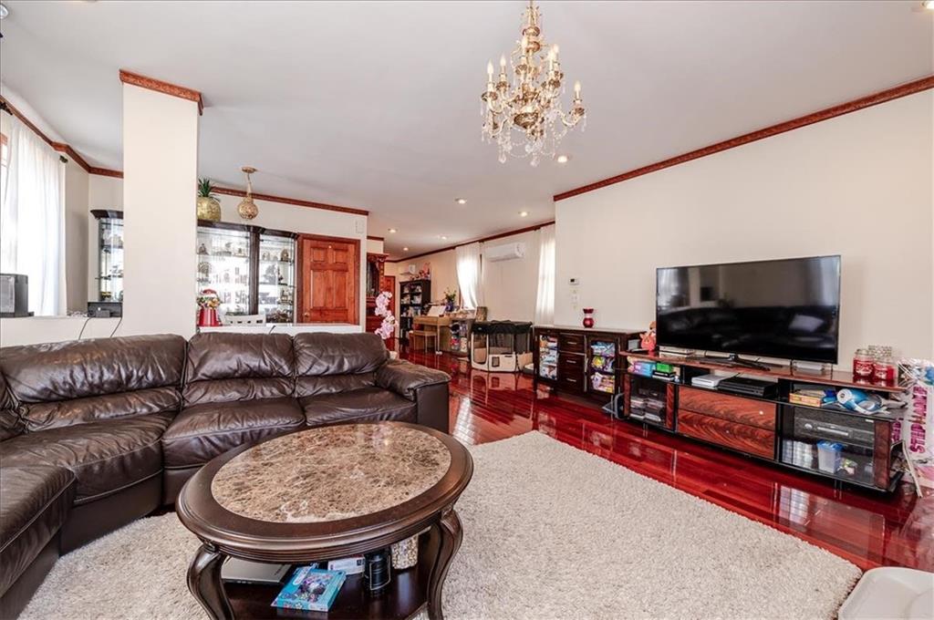 1722 Ave V Brooklyn, NY 11229 - Photo 6 of 28 a living room with furniture and a flat screen tv