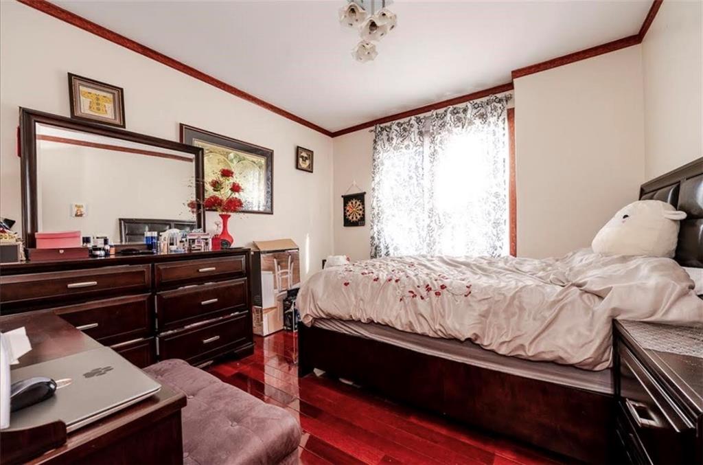 1722 Ave V Brooklyn, NY 11229 - Photo 8 of 28 a bedroom with a bed and a dresser