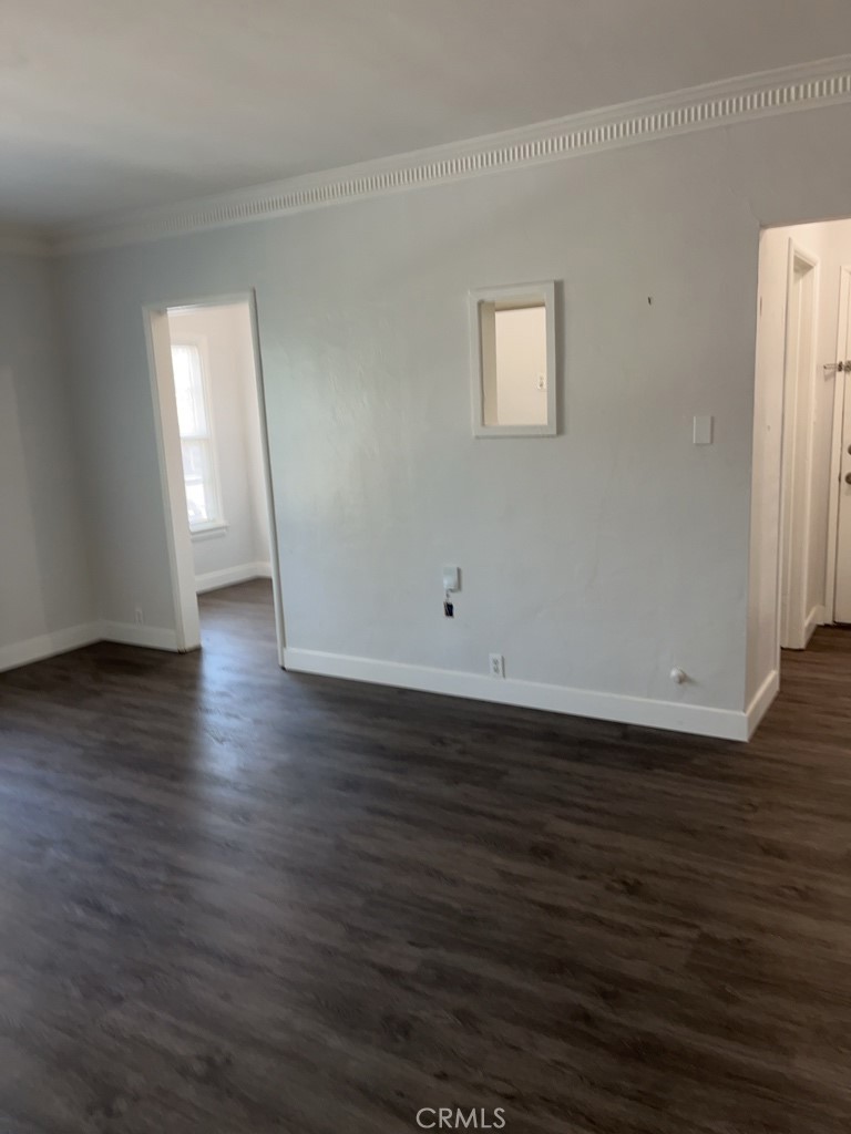 3900 5th Street, Unit 23 Riverside, CA 92501 - Photo 15 of 26 a view of a room with wooden floor and window