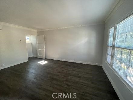 3900 5th Street, Unit 23 Riverside, CA 92501 - Photo 2 of 26 an empty room with wooden floor and windows