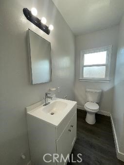 3900 5th Street, Unit 23 Riverside, CA 92501 - Photo 22 of 26 a bathroom with a toilet sink and mirror