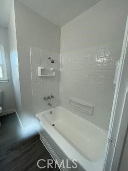 3900 5th Street, Unit 23 Riverside, CA 92501 - Photo 23 of 26 a bathroom with a tub and a shower