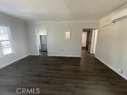 3900 5th Street, Unit 23 Riverside, CA 92501 - Photo 4 of 26 a view of empty room with window and wooden floor